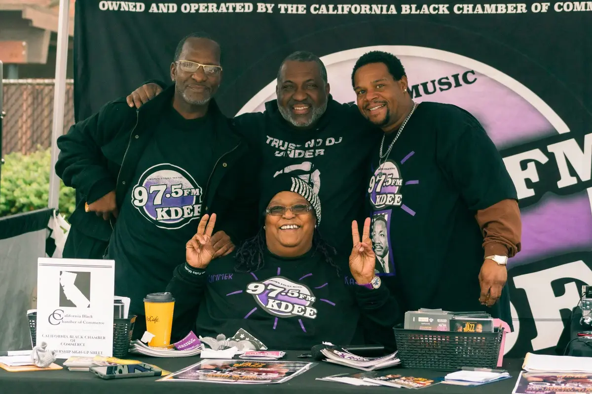 Radio hosts welcome visitors at their Expo booth