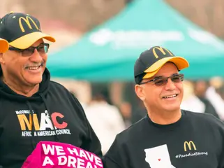 Two men laugh together at the march
